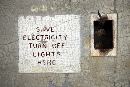 Destroyed electrical outlet and sign